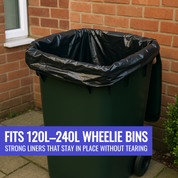 Black trash bag in a green wheelie bin against a brick wall.