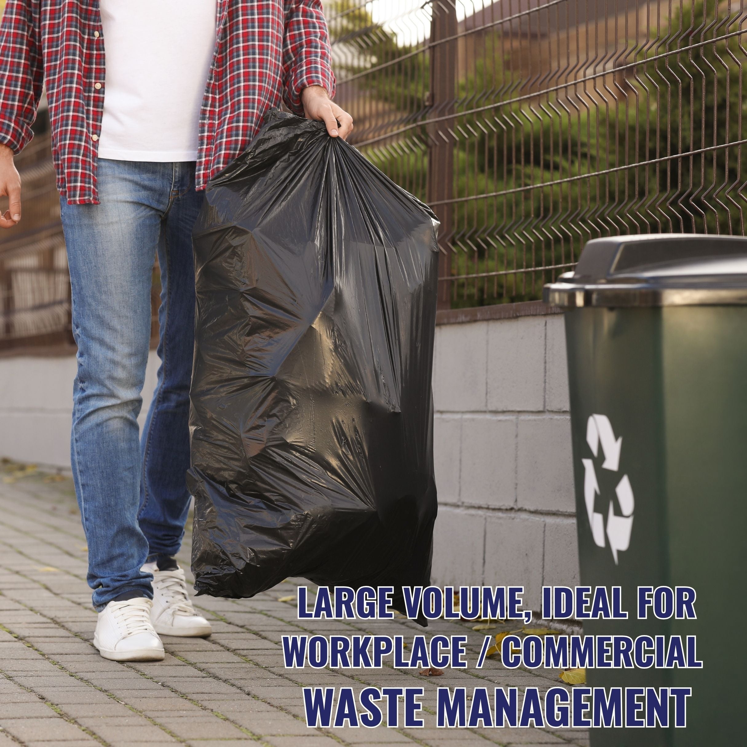 Person holding a large black垃圾袋 near a recycling bin with text about waste management.