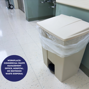 Beige trash bin with a plastic bag in a bathroom setting, labeled for workplace or commercial waste management | | Liquipak Medium Duty Clear Refuse Sacks