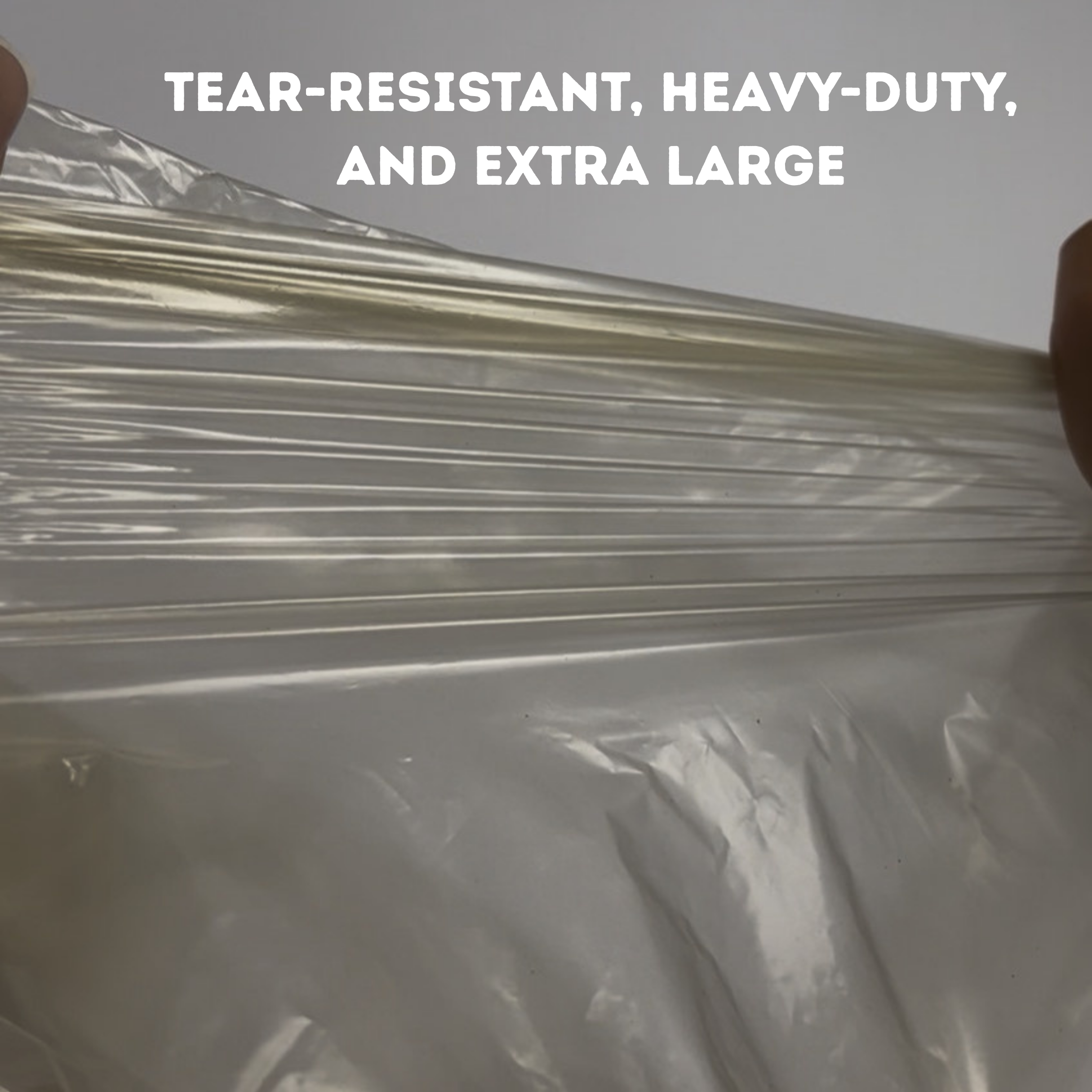 Clear plastic wrap with text indicating tear-resistance, heaviness, and size.