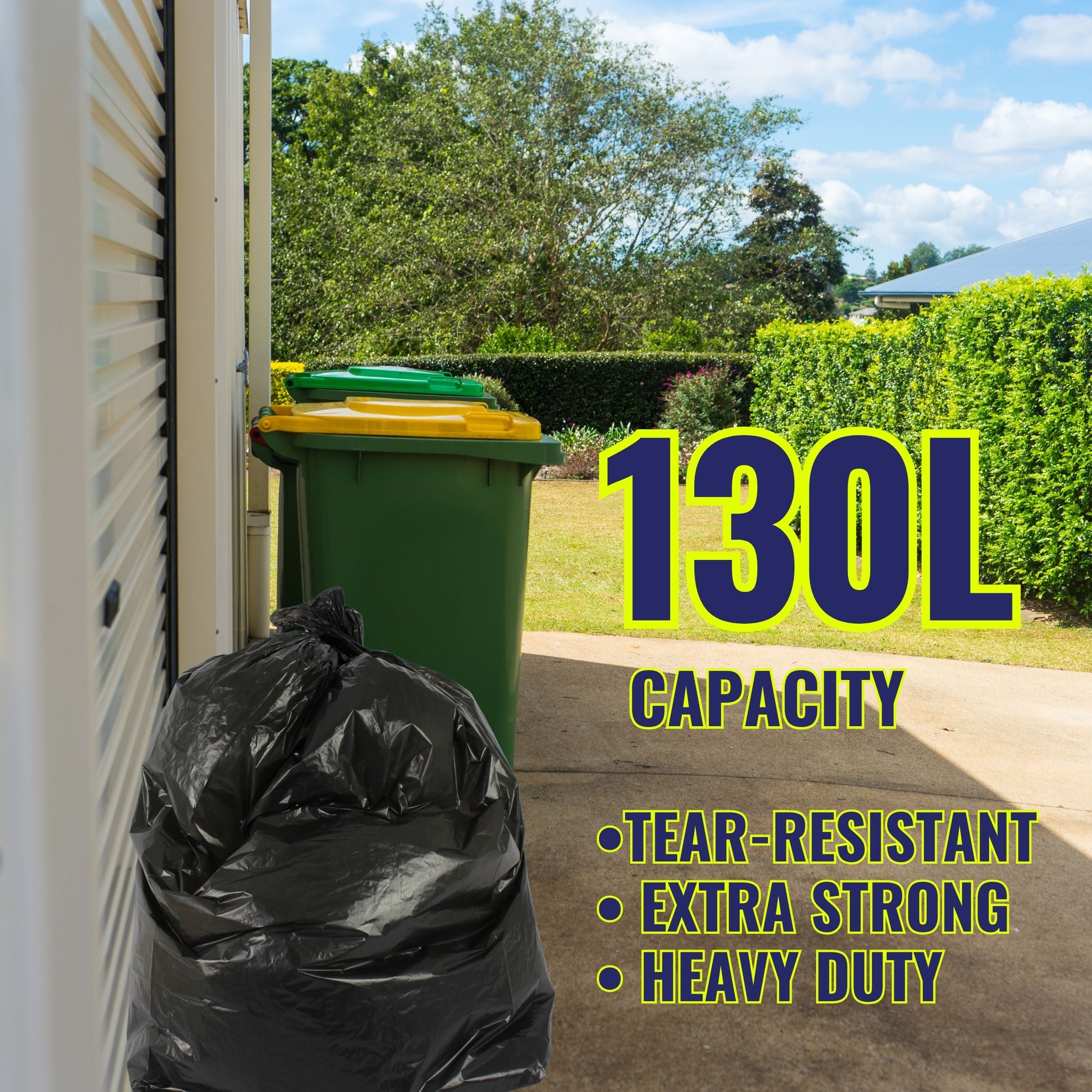 Green trash bin with a black bag labeled '130L Capacity' in front of a house.