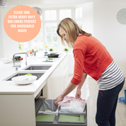 Woman in a kitchen using a trash bin with text about clear tool extra heavy duty bin liners | Liquipak