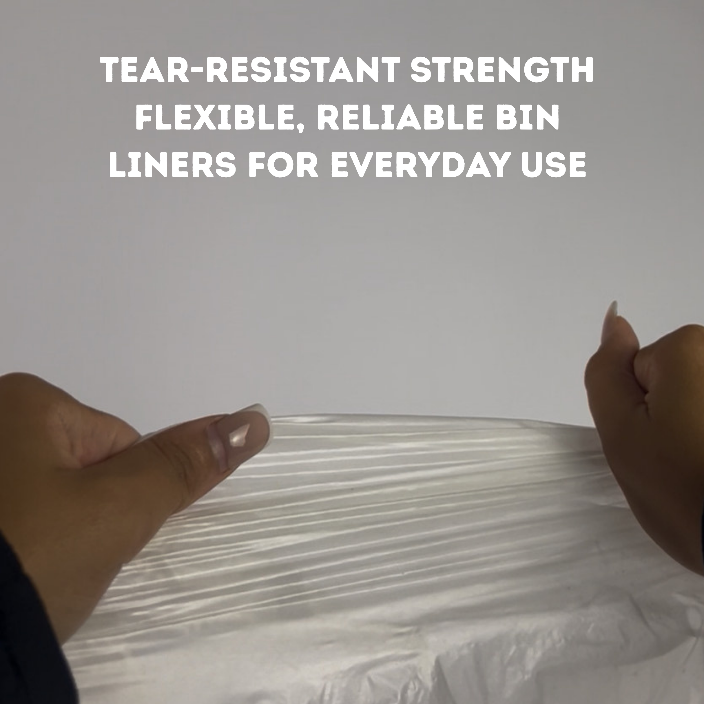 White bin liner with text about tear-resistant strength and reliability, held by hands against a light gray background | Liquipak Medium Heavy Duty Clear Refuse Sacks